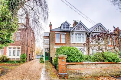 a large brick house with a brick road at Entire studio with private parking and balcony in Southend-on-Sea