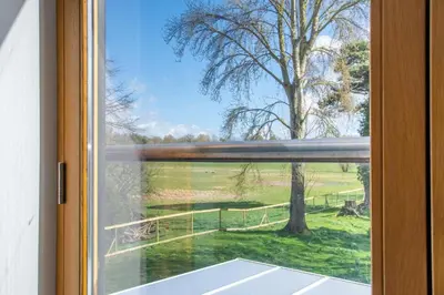 a window with a view of a field outside at 2 Bed in Eccles oc-l27507 in Eccles