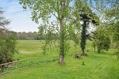 a field with two trees and a fence at 2 Bed in Eccles oc-l27507 in Eccles
