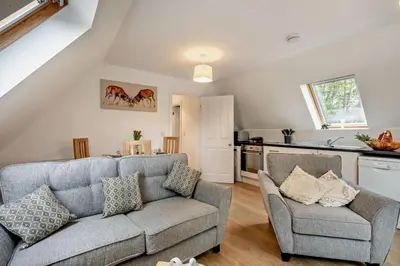 a living room with a couch and a kitchen at 2 Bed in Eccles oc-l27507 in Eccles