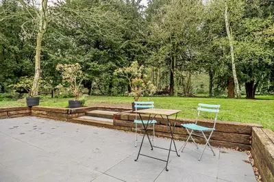 two chairs and a table in a garden at 2 Bed in Ketteringham oc-p27381 in East Carleton