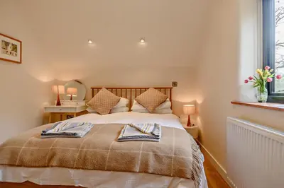 a bedroom with a bed with two towels on it at 2 Bed in Ketteringham oc-p27381 in East Carleton