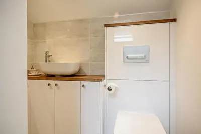 a bathroom with a white sink and a toilet at 2 Bed in Ketteringham oc-p27381 in East Carleton