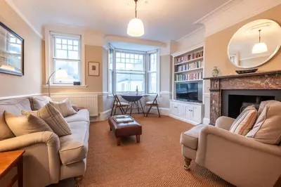a living room with a couch and a fireplace at 1 Bed in Aldeburgh oc-h28976 in Aldeburgh