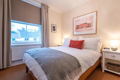 a bedroom with a large bed and a window at 1 Bed in Aldeburgh oc-h28976 in Aldeburgh
