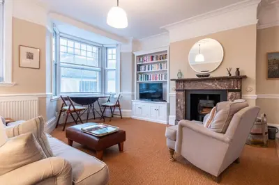 a living room with a couch and a fireplace at 1 Bed in Aldeburgh oc-h28976 in Aldeburgh