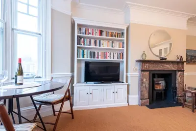 a living room with a television and a fireplace at 1 Bed in Aldeburgh oc-h28976 in Aldeburgh