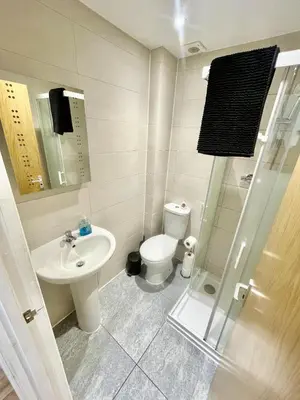 a small bathroom with a sink and a toilet at 1 Bed Studio - Sleeps 2 - Parking - Wifi in Cambridge
