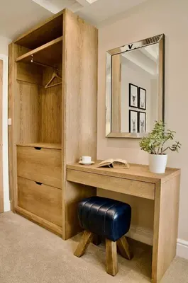 a dressing room with a desk and a mirror at The Sunset Nook in Ipswich