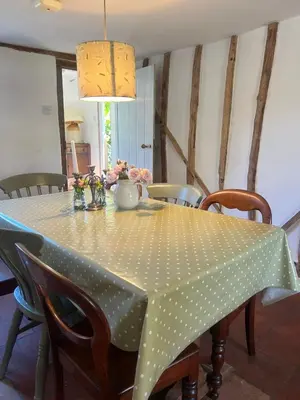 a table with a polka dot table cloth on it at Rose Cottage Darsham - Suffolk Coastal in Darsham