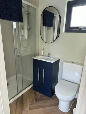 a bathroom with a toilet and a sink and a shower at Gorgeous studio! in Cherry Hinton
