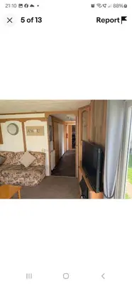 a room with a bed and a tv in a room at Rose Manor in Little Clacton