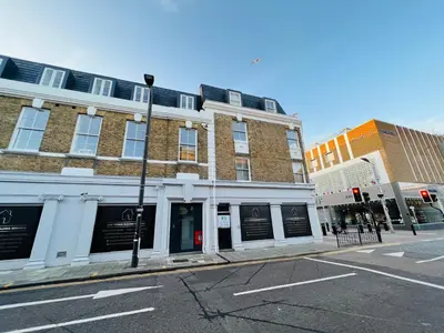 a building on the corner of a street at Stunning New Penthouse Apartment in Southend-on-Sea