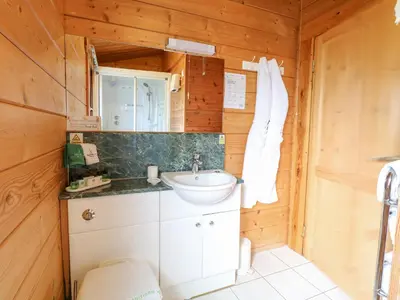 a bathroom with a sink and a toilet at Heron Lodge in Langham