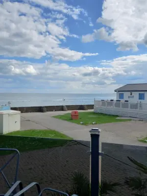 a view of the ocean from a balcony at 2 bedroom Mini Lodge Caravan at Coopers Beach Holiday Park in East Mersea