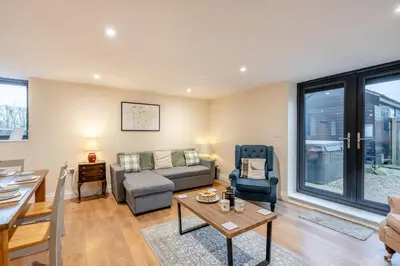 a living room with a couch and a table at 2 Bed in Feering oc-p29293 in Feering