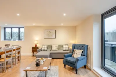 a living room with a couch and a table at 2 Bed in Feering oc-p29293 in Feering