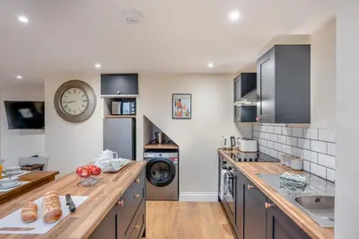 a kitchen with a counter with a sink and a stove at 2 Bed in Feering oc-p29293 in Feering