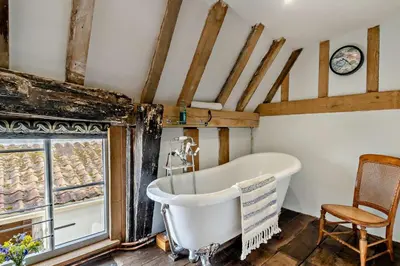 an old bath tub in a bathroom with a window at 3 Bed in Rumburgh oc-c27094 in Rumburgh