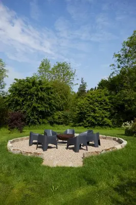 a group of chairs sitting in a circle in a park at Restaries at Paradise Farm in Halesworth