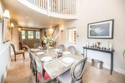 a dining room with a table and chairs at Little Fig in Aldeburgh