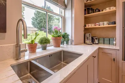 a kitchen with a sink and a window at Little Fig in Aldeburgh