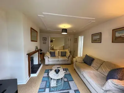 a living room with two couches and a coffee table at 1 bed annex with extra sofa bed ideal for families and business guests in Littleport