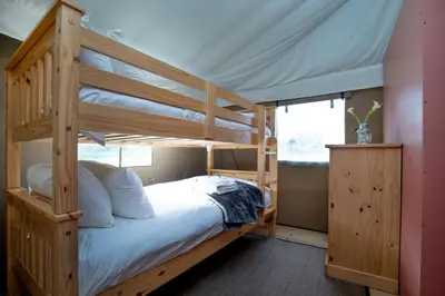 a bedroom with a bunk bed with a ladder at Cuckoo - Sweffling Hall in Rendham