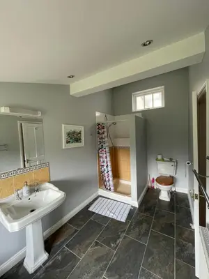 a bathroom with a sink and a toilet at The Grange in Attleborough