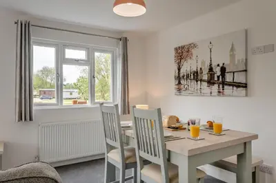 a dining room with a table and chairs and a window at 2 Bed in Welney oc-k29369 in Welney