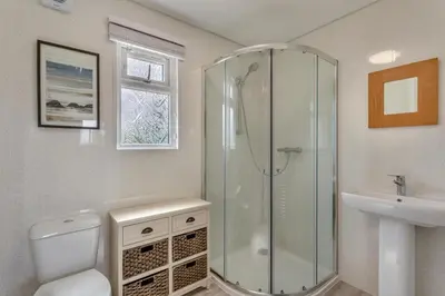 a bathroom with a shower and a toilet and a sink at 2 Bed in Welney oc-k29369 in Welney