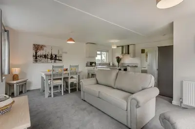 a living room with a couch and a table at 2 Bed in Welney oc-k29369 in Welney
