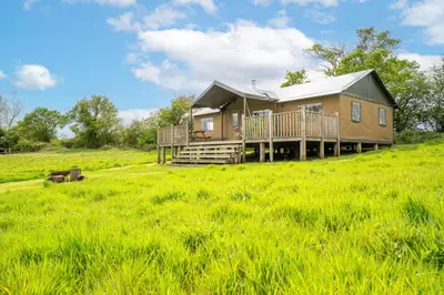 a house on a hill in a field at Linnet - Sweffling Hall in Rendham