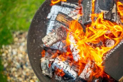 a close up of a fire in a grill at Linnet - Sweffling Hall in Rendham