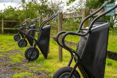 a row of carts parked next to a fence at Swallow - Sweffling Hall in Rendham