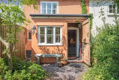 an outside view of a house with a door at 2 Fox Cottage, Darsham in Darsham
