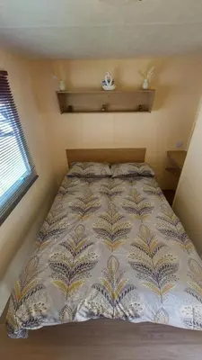 a large bed in a small room with a window at SKYLA VISTA Deluxe in Clacton-on-Sea