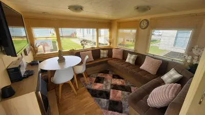 a living room with a couch and a table at SKYLA VISTA Deluxe in Clacton-on-Sea