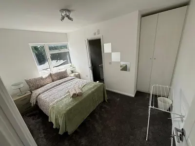 a bedroom with a bed with a towel on it at Cosy rooms in Cambridge in Cambridge
