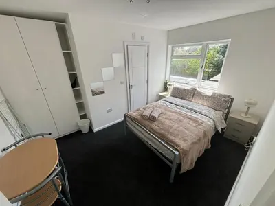 a bedroom with a bed and a window at Cosy rooms in Cambridge in Cambridge