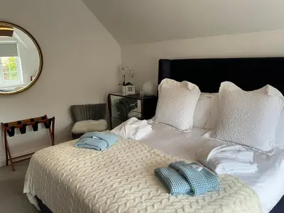 a bedroom with a bed with two pillows on it at Frinton45 in Frinton-on-Sea