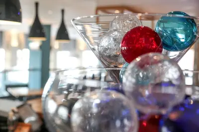 a bunch of glass balls sitting on a table at The Brudenell in Aldeburgh