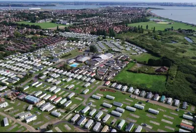 an aerial view of a parking lot with houses at Modern & Blissful Beach Park Holiday Home in Dovercourt, Essex, in Parkeston