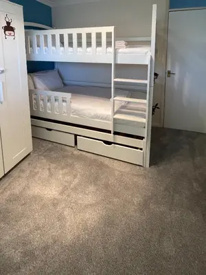 two white bunk beds in a room at Spacious House Near Cambridge - Free Parking and Garden in Cambridge