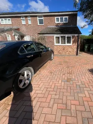 a car parked in front of a brick house at Spacious House Near Cambridge - Free Parking and Garden in Cambridge