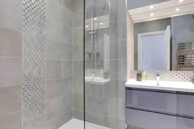 a bathroom with a shower and a sink at Chelmer Springs Maisonettes in Chelmsford