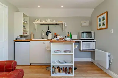 a small kitchen with a counter and a microwave at 1 Bed in Cratfield oc-t29434 in Cratfield