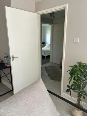 a room with a door leading to a bedroom at DK House in Colchester