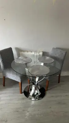 a table with two chairs and a table with two tables at DK House in Colchester