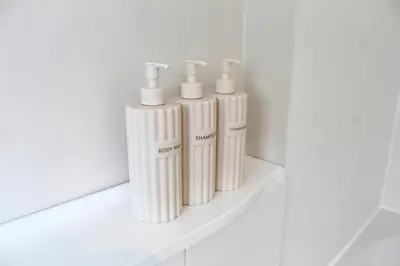a group of three white gas cylinders sitting on a shelf at Cosy Cottage in Mersea - Walking distance to beach and town in West Mersea
